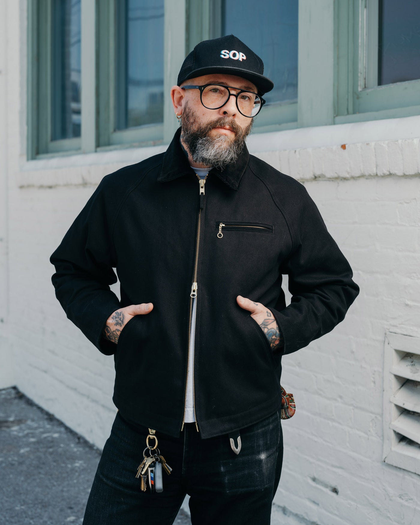 Man wearing black zip jacket