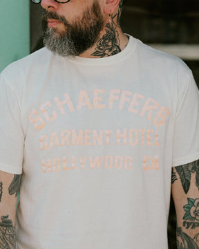 Schaeffer's Garment Hotel Cycle Varsity Tee Pink Cracked Print