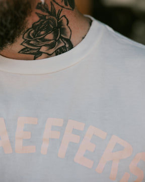 Schaeffer's Garment Hotel Cycle Varsity Tee Pink Cracked Print